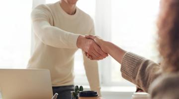 Image of executives shaking hands